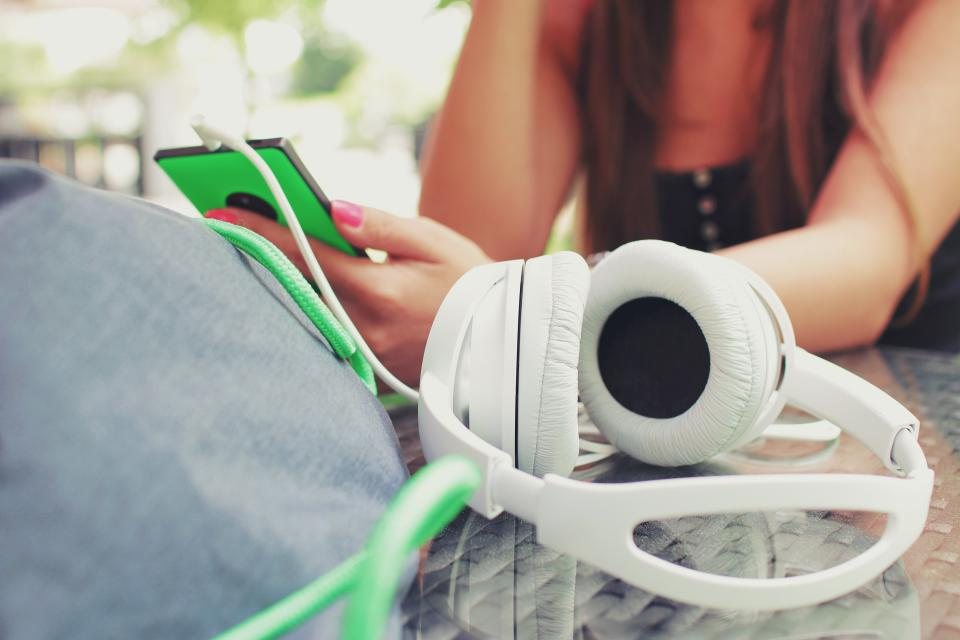 Headphones lying next to a phone