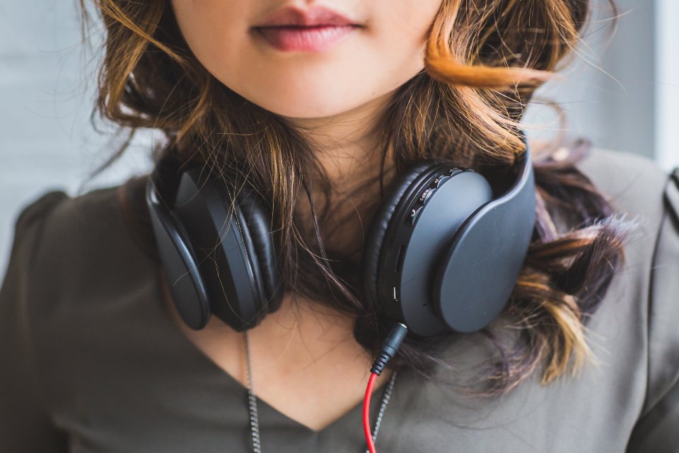 A woman listening with headphones